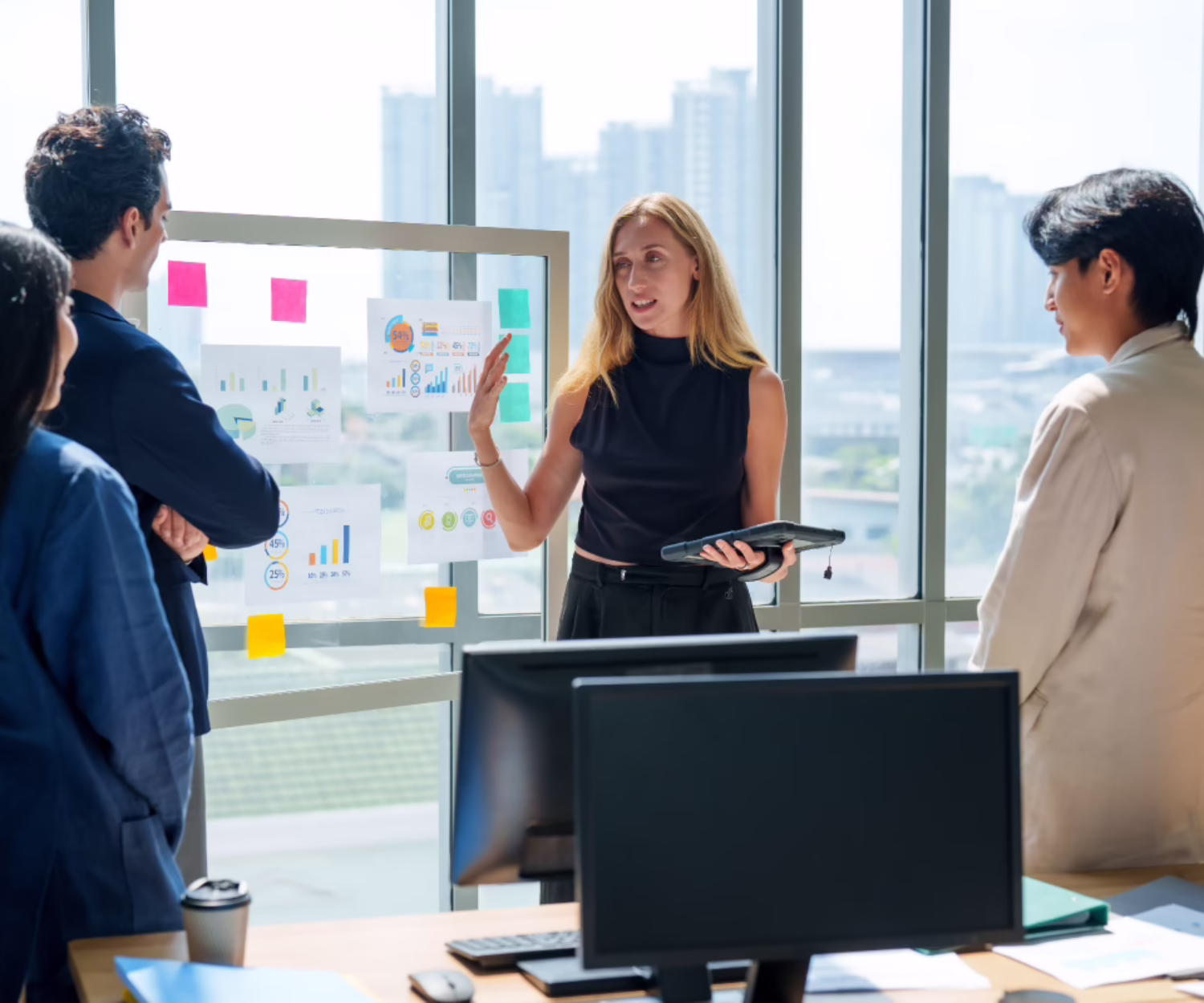 Marketing team collaborating on data-driven strategy and AI governance in a modern office