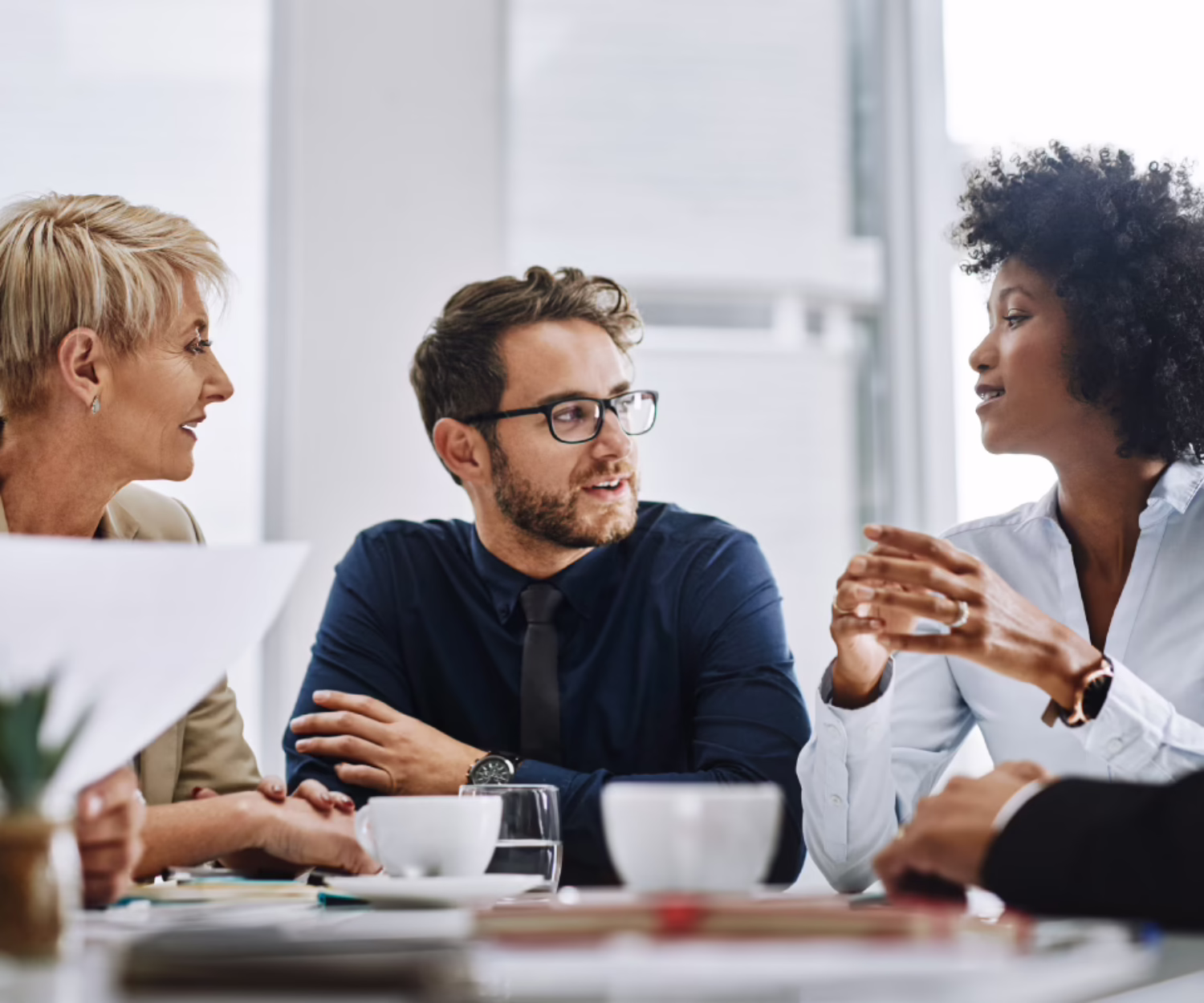 Team discussing strategy during a collaborative business meeting in a modern office
